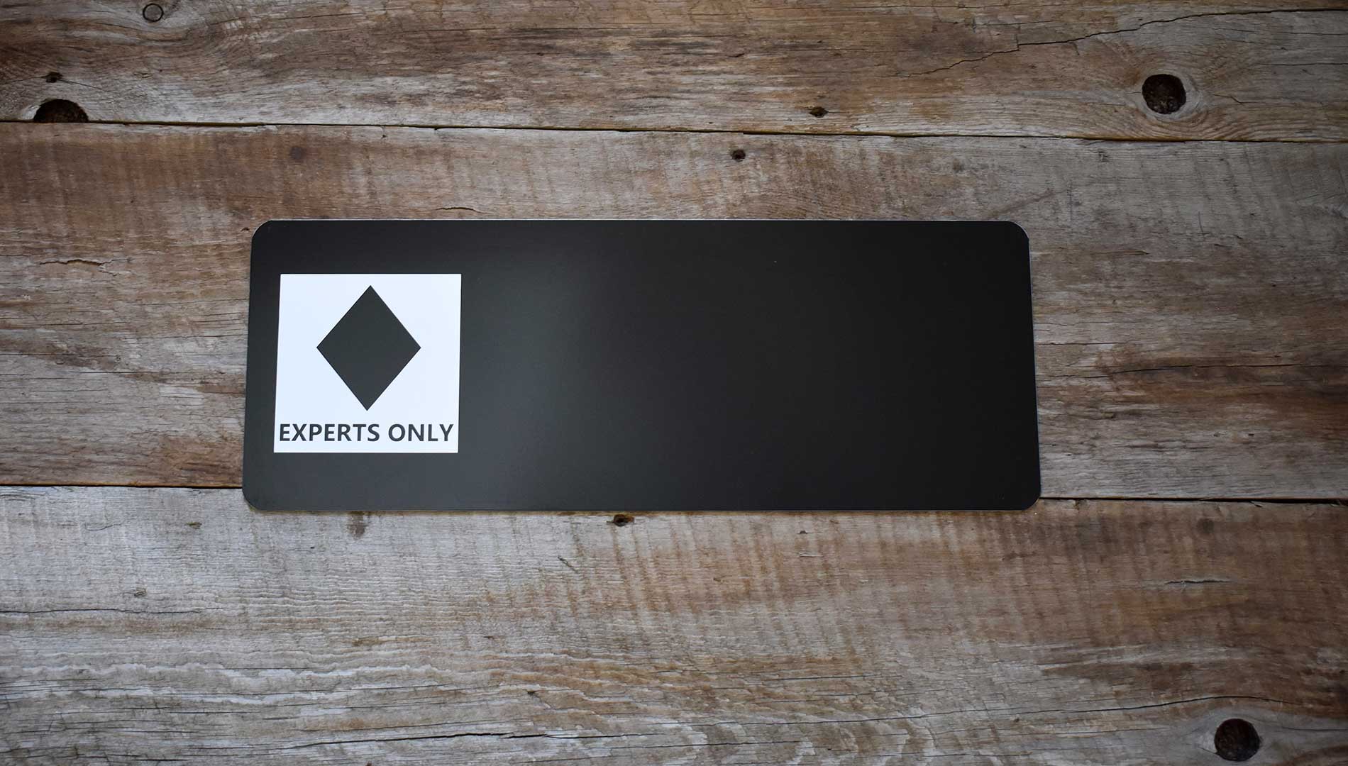 custom black diamond ski run sign with a black background and white text