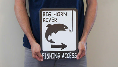 man holding a customizable brown and white metal fishing access sign