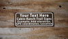 custom forest service style sign with white text and brown background on a wood background