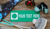 a custom metal green ski run sign with a green background and white text that says 'Your Text Here' with ski gear around the sign