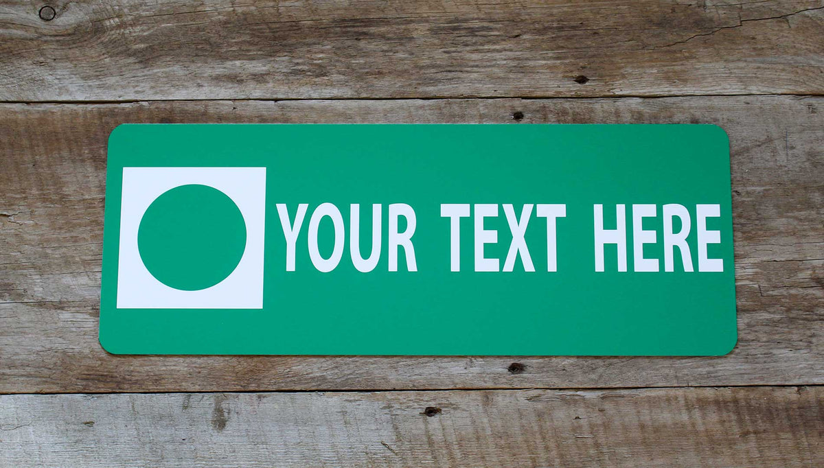 a custom metal green ski run sign with a green background and white text that says 'Your Text Here'