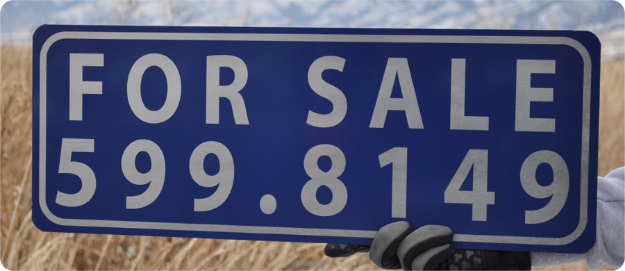 white text that says 'for sale' with a blue background on a metal sign