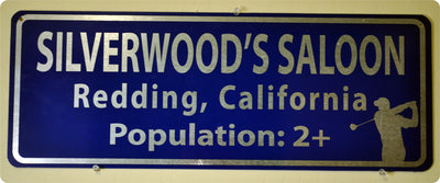 metal sign with white text that says 'silverwood's saloon' on a blue background
