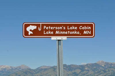 lake cabin sign with a brown background and white text that says 'Peterson's Lake Cabin Lake Minnetonka, MN'